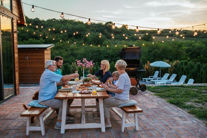 Multi-generational family around picnic table