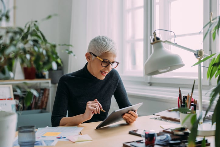 Older woman looking at ipad screen